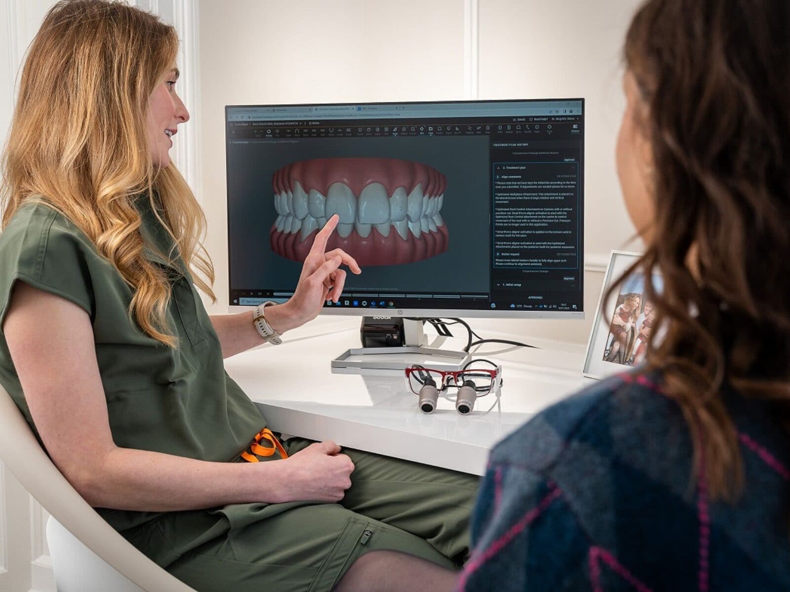 A dentist and patient talking through a treatment plan