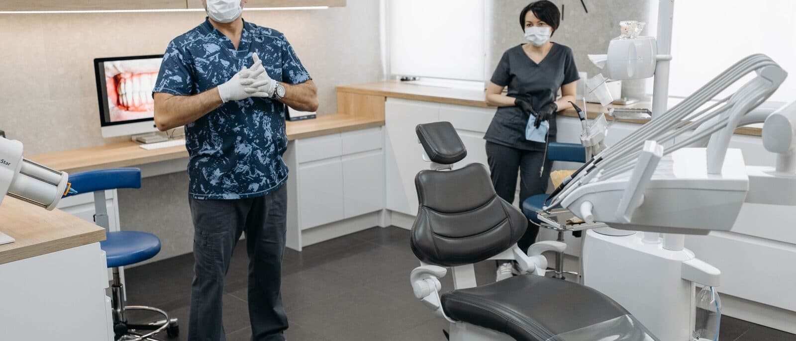 A dentist talking a patient through their treatment plan